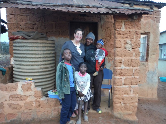 Part of the family in front of the hut